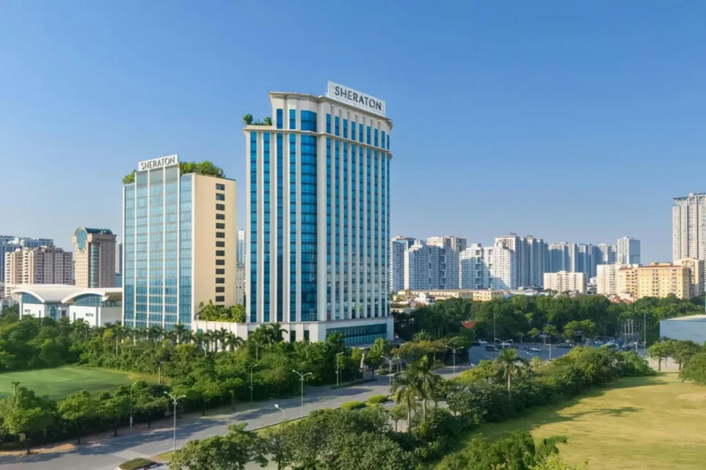 The 25-story twin towers. The SHERATON sign on the roof is visible from far away
