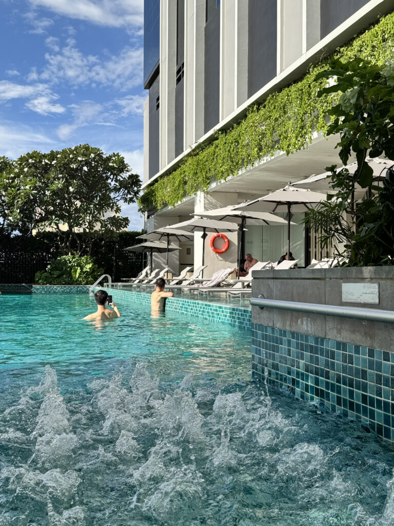Sun loungers with water flowing beneath