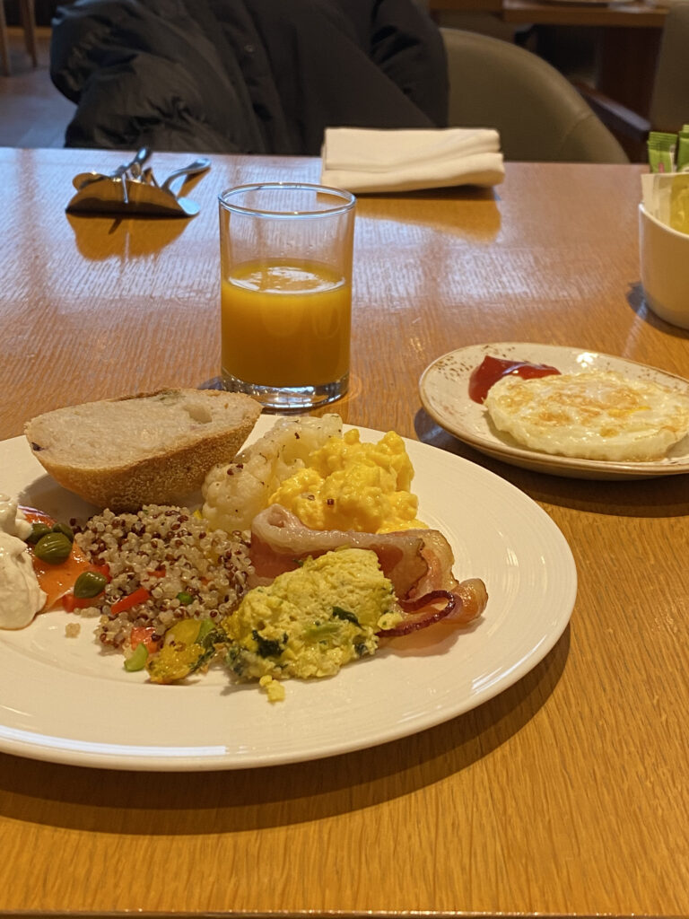 The breakfast hall. Big windows, spacious seating, and good morning light