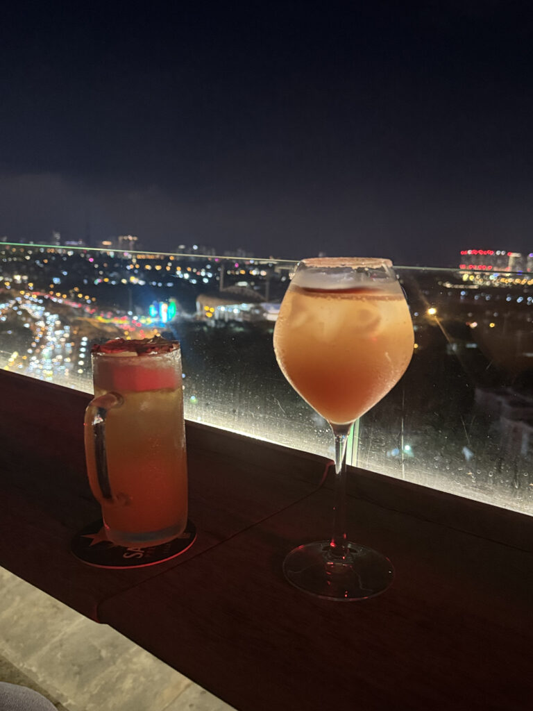 Two cocktails we ordered. One drink against the night view