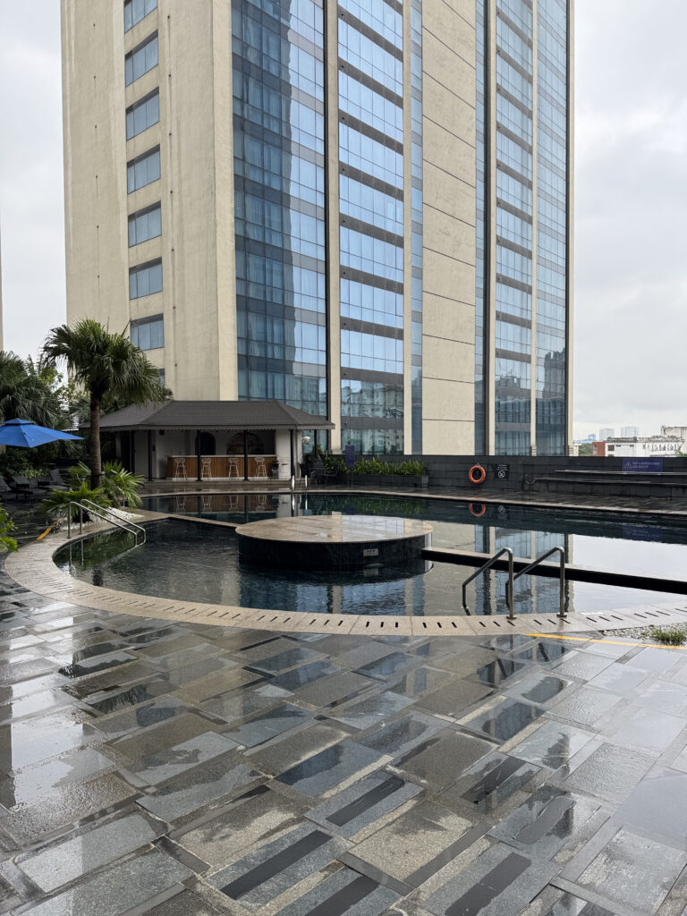 The outdoor pool, with the hotel building behind it
