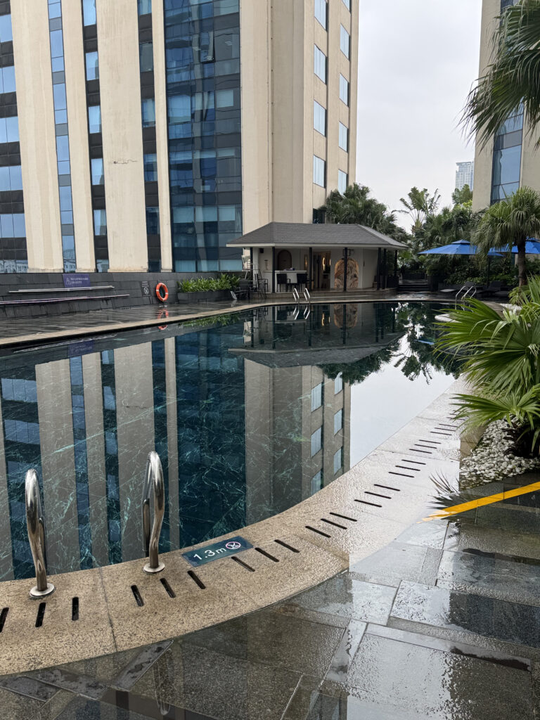 The pool edge. The 1.3 m depth marking and the anti-slip line